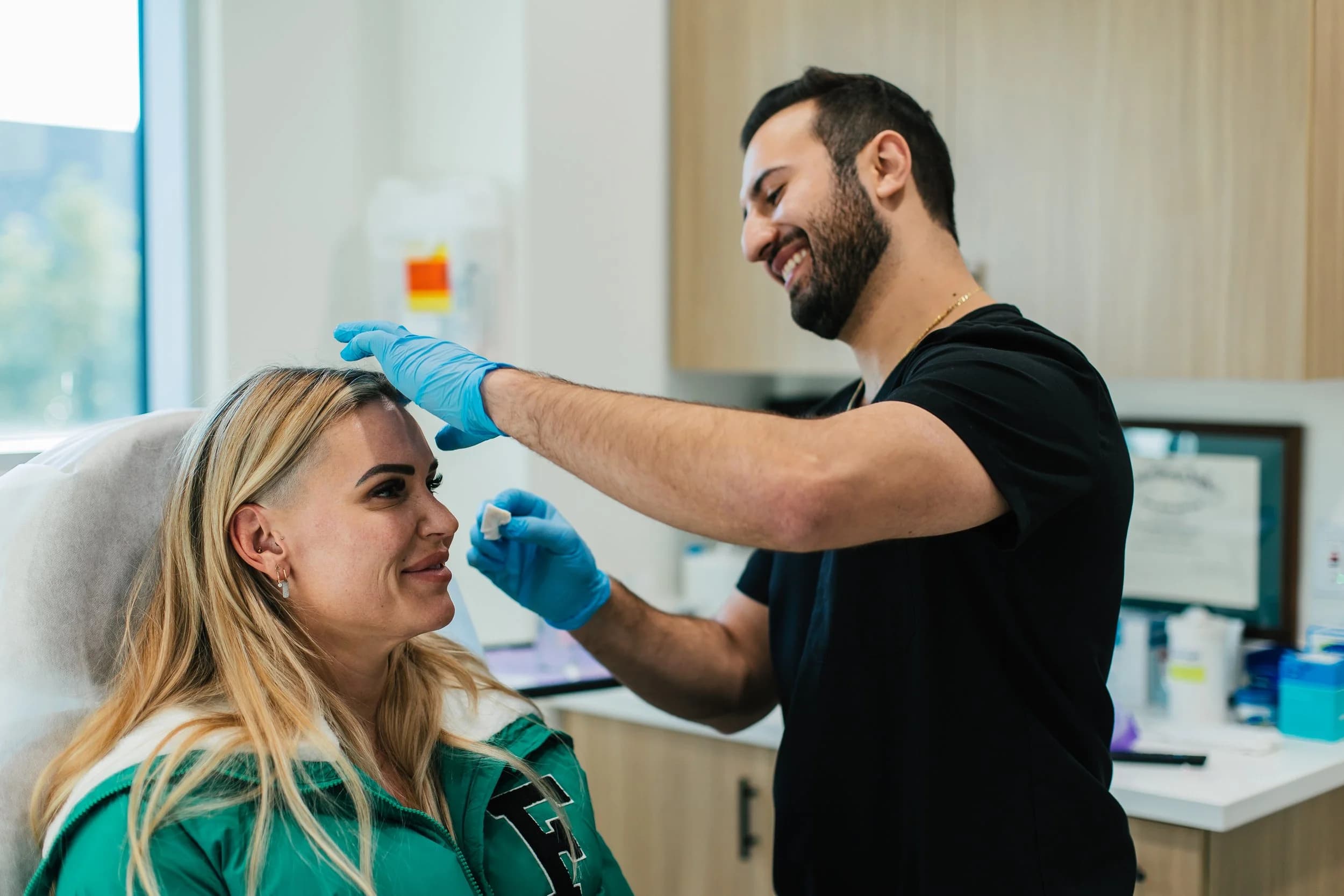 Dr. Chris Tomassian performing a cosmetic treatment