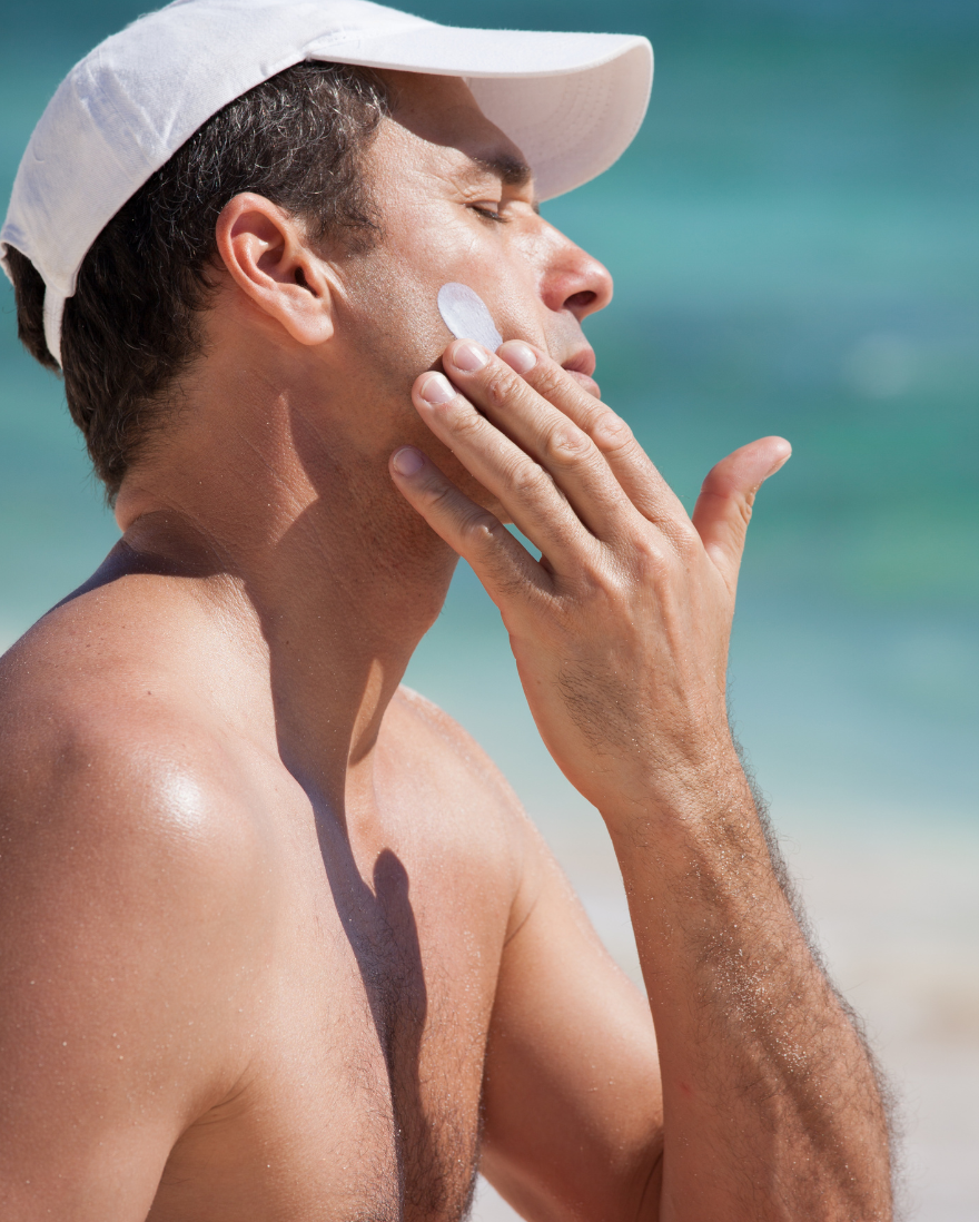 Man Applying SPF Sunscreen